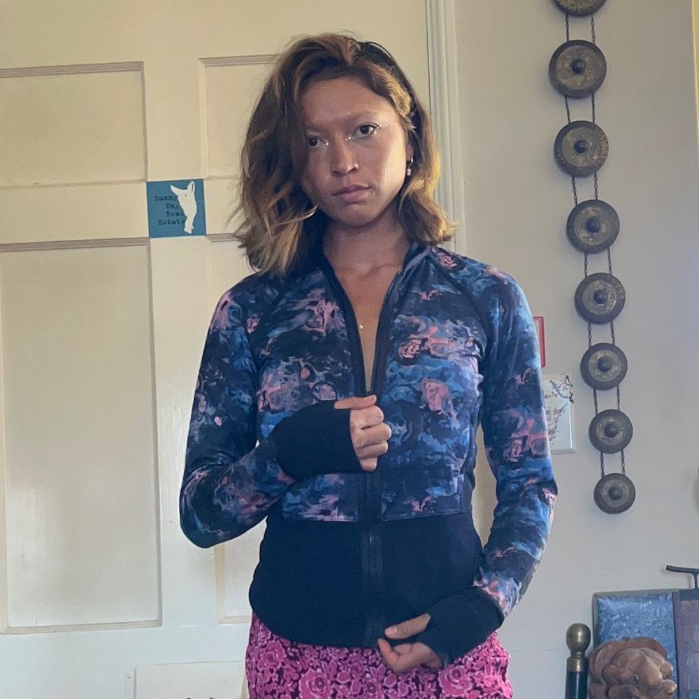 Blue and pink patterned yoga/athletic jacket.